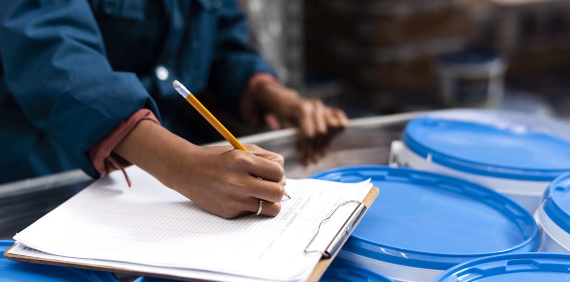 woman-worker-taking-notes-warehouse woman-worker-taking-notes-warehouse