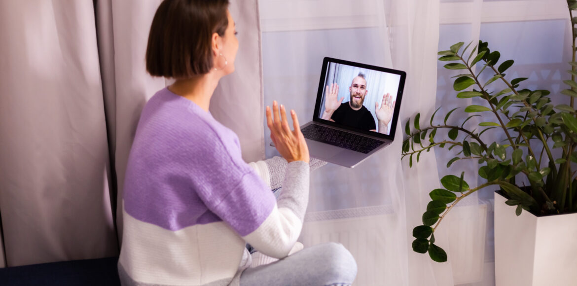 Woman at home face time video call her friends husband boyfriend, chatting online from laptop Woman at home face time video call her friends husband boyfriend, chatting online from laptop